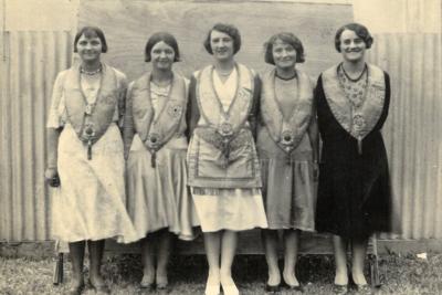 Black and white photo of five women wearing Manchester Unity Independent Order of Oddfellows from the 1920s